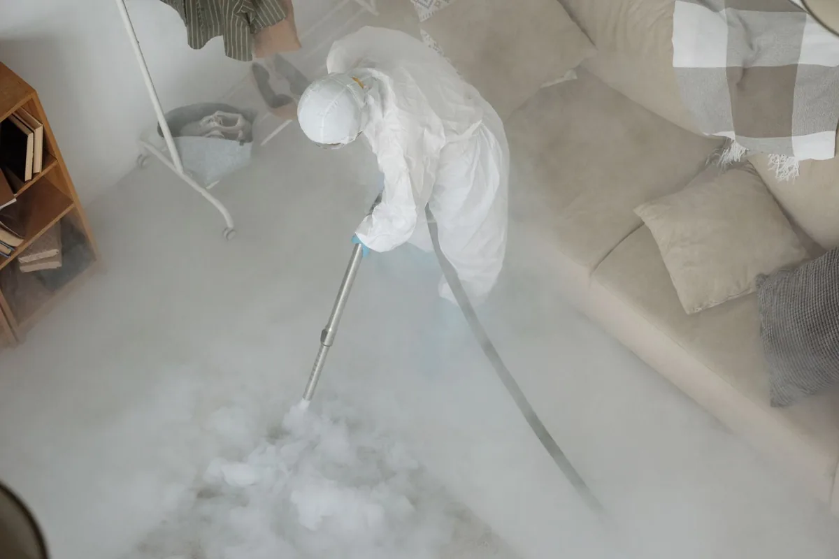 Biohazard cleanup technician in protective equipment, Sarcoxie, MO